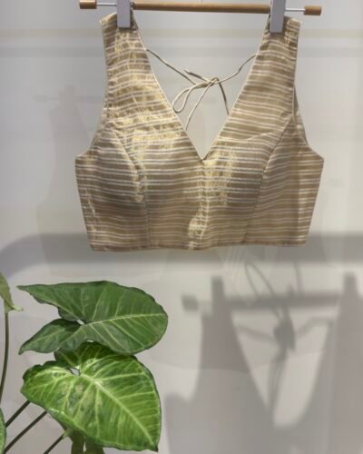 Off-white Zari stripes sleeveless.