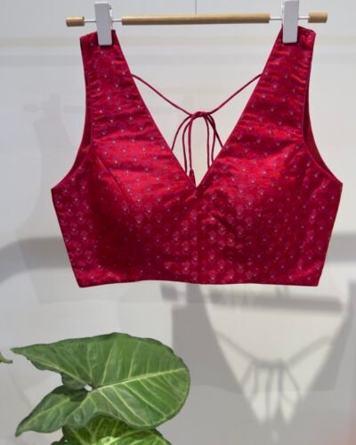 Red Jacquard v neck sleeveless.